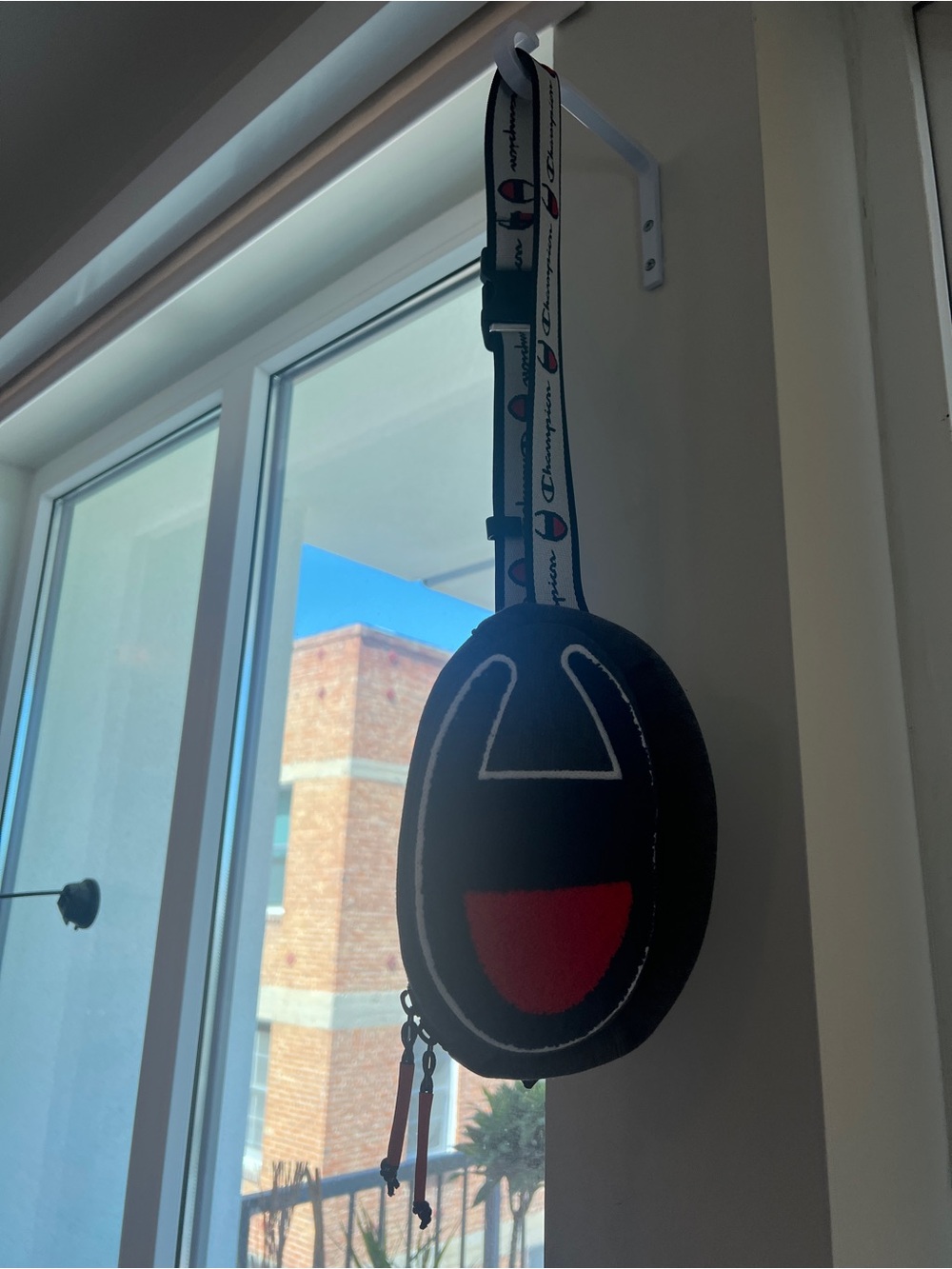 Champion Oval Crossbody with Red Accent and Logo Strap
